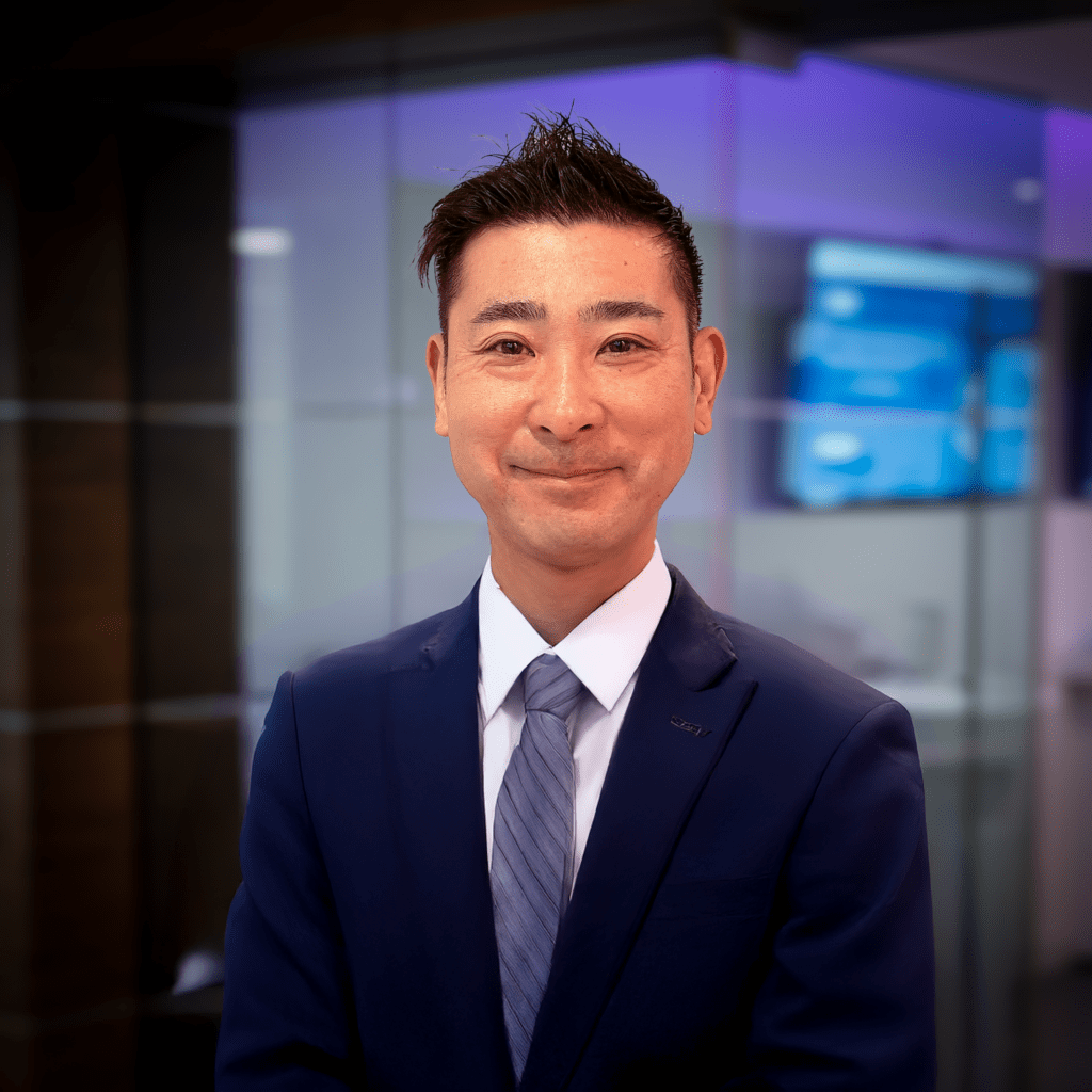 Taichi Kitamura stands in front of the Content Guru CX suite.